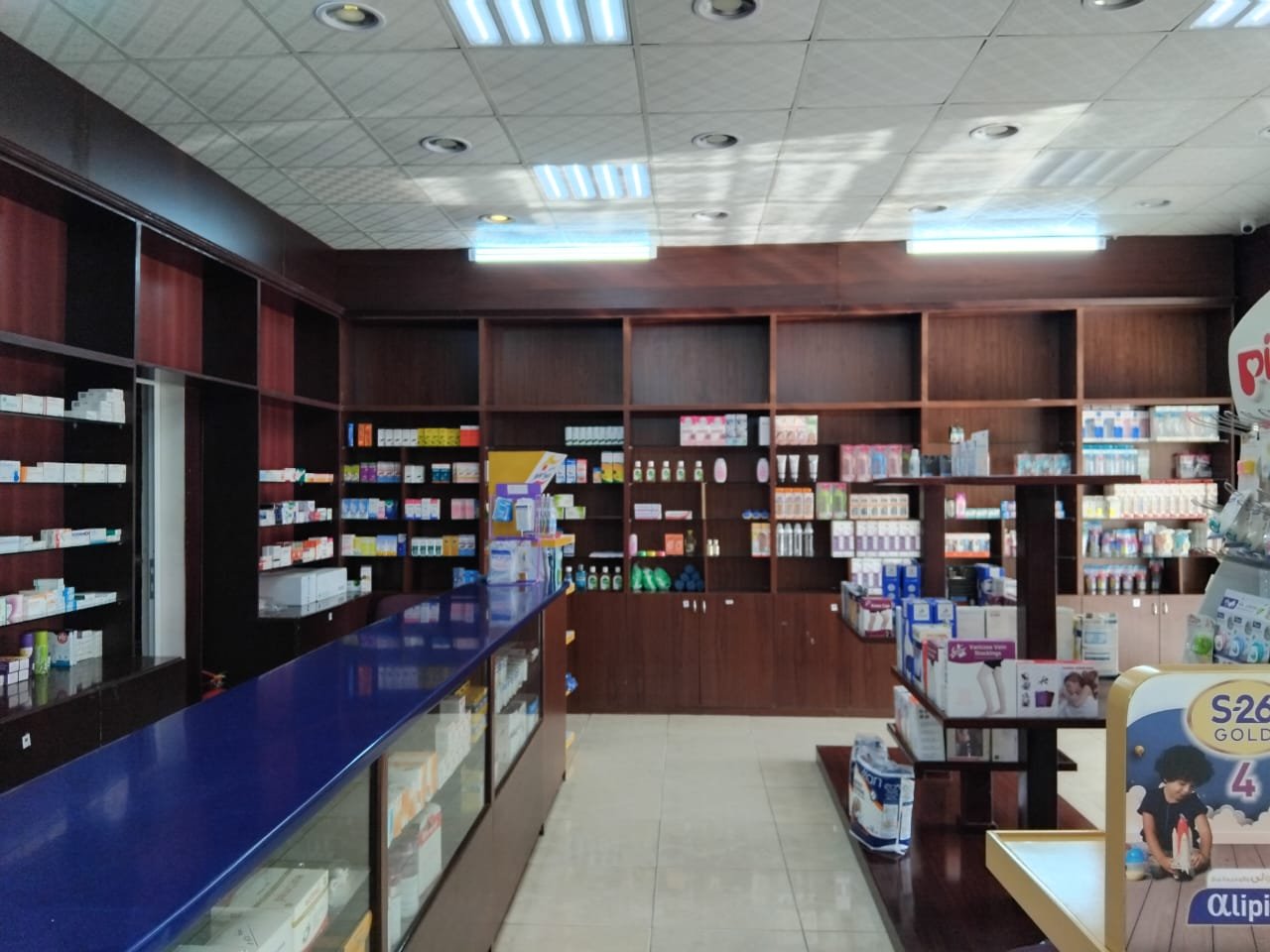 Interior view of Al Farooq Polyclinic Pharmacy in Oman, offering a wide range of medicines, healthcare products, and baby care essentials. Visit us for quality pharmaceutical services and expert guidance.